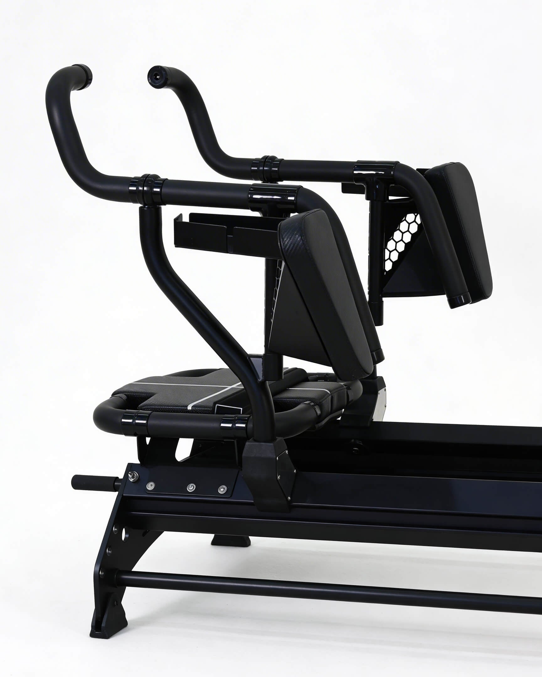 Black Reformer exercise machine on a white background